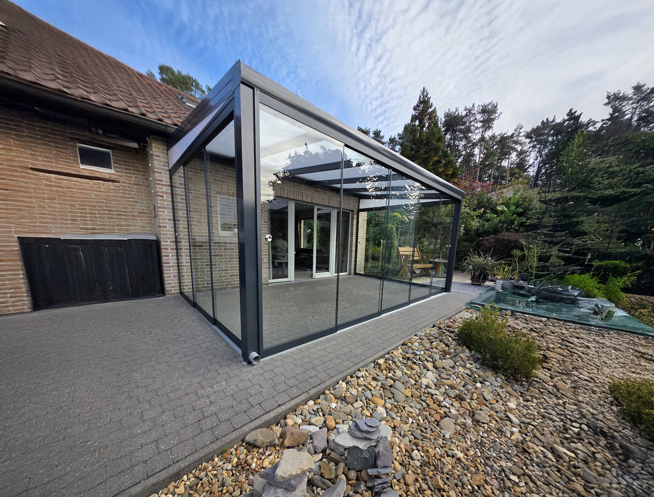 Veranda met schuifwanden
uit glas voor maximaal uitzicht