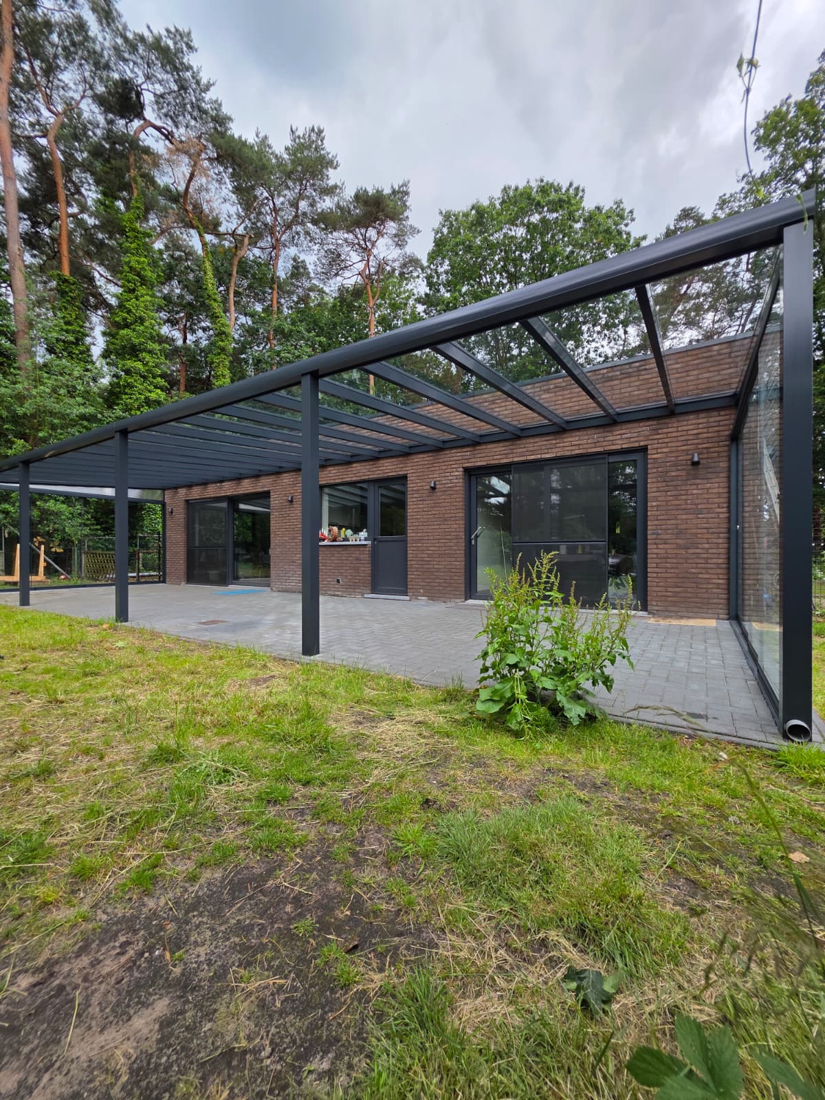 Glazen terrasoverkapping in Zoersel – 13×4 m met schuifwanden